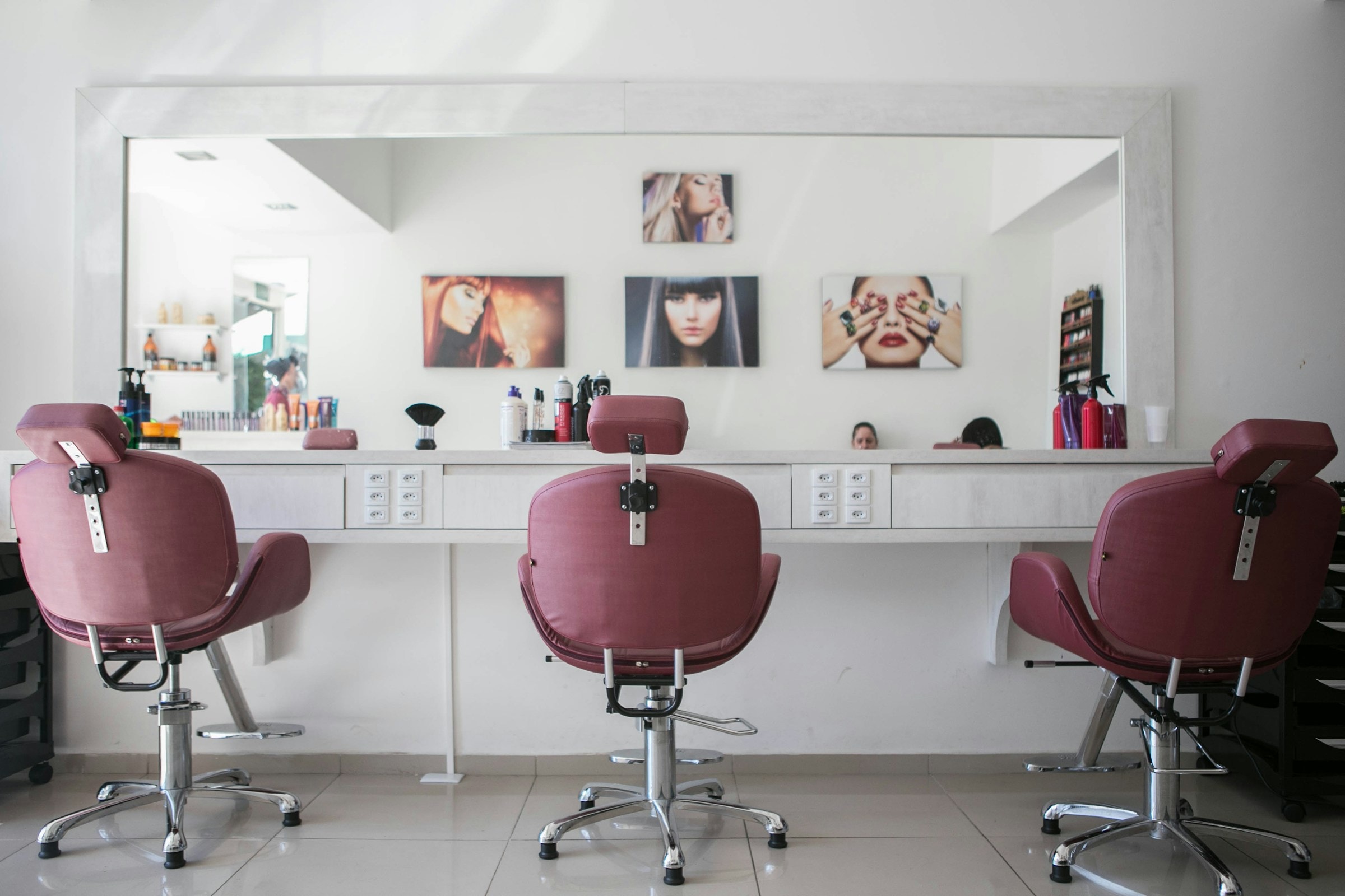 Inside the Lalə atelier — styling chairs at the mirror bar.